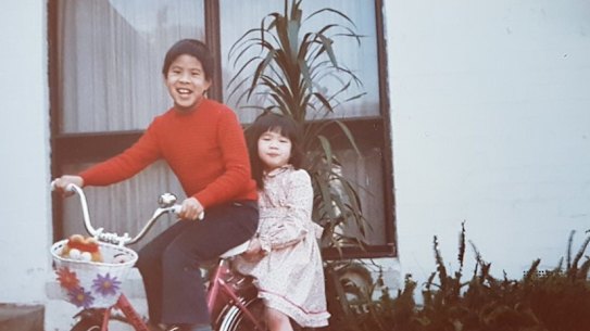 Kelly Eng and her brother as children outside their Glen Waverley home.