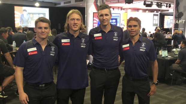 Freo coach Justin Longmuir with the club's draftees Caleb Serong (no.8), Hayden Young (no.7) and Liam Henry (no.9).