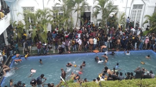 Protesters take a dip in the president’s pool.