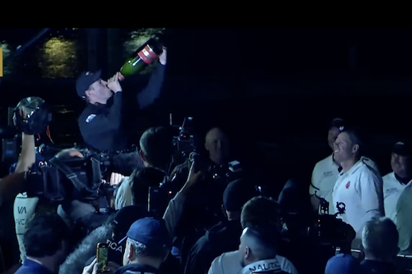 John Winning Jr celebrated with champagne.