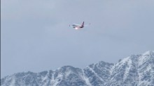 A Qantas plane bound for Queenstown in New Zealand has been diverted to Christchurch after flames appeared to sputter from the engine.