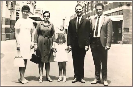 Author Olympia Koziaris c1968 as a child, centre, in Yarraville’s Ballarat Street, with her parents and grandparents.