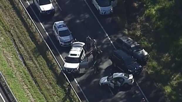 Armed car thief hit by car after Bruce Highway police chase, shootout