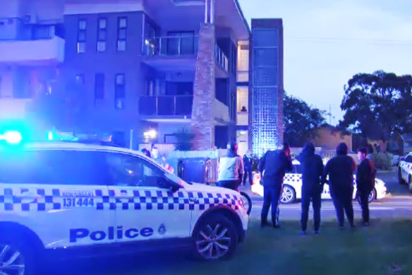 Police outside of the Altona North apartment building where the nine-year-old died on Saturday night.