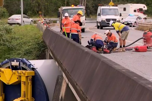 A team works to remove the turbine after it became stuck.