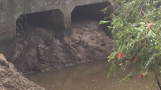 The 100 cubic metres of soil inside this drain at Carole Park, where police searched in 2016.