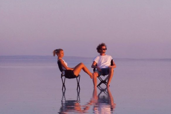A post from the couple sitting in a salt lake in Turkey.
