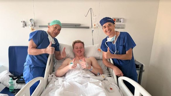 Billy Baldwin with Charlie Teo after having a tumour removed from his lower back in the Hospital Universitario Fundacion Jimenez Diaz in Madrid, Spain.