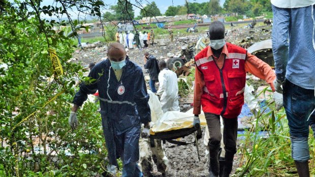 Salah Raya (left) training first responders and helping treat the injured after an oil tanker exploded in a small village 300km away from the capital, Juba, in South Sudan.  