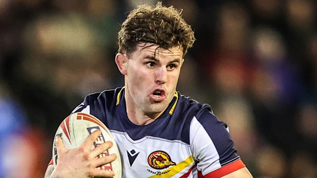 Toby Sexton of Catalans Dragons breaks with the ball.