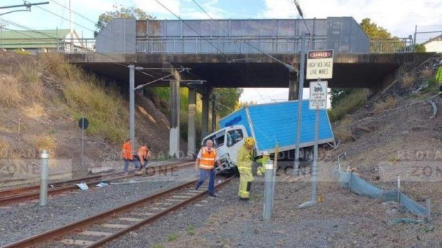 A truck has crashed onto railway tracks near Manly Station.