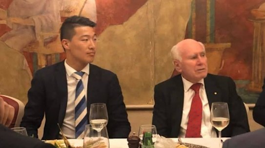 Scott Yung, then the Liberal candidate for the state seat of Kogarah, sitting next to John Howard during a fundraiser at the Blue Angel restaurant.