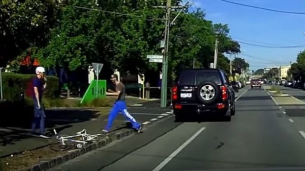 The cyclist is approached by the driver. 