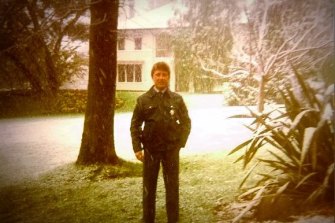 Nigel Brown, standing in the snow with the Lodge at rear, in 1987. 