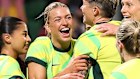 Players mob Charli Grant after her winner at the death.