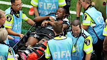 Canada's Ismael Kone is stretched off after being fouled by Assim Madibo.