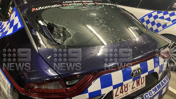A police car damaged when a “hooning incident” on the Gold Coast turned violent on Saturday night. 
