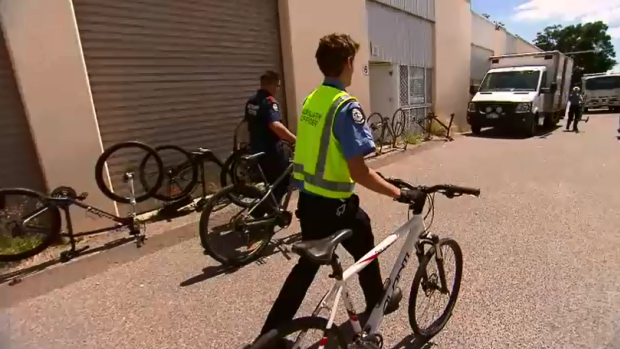 Police with the stolen bikes.