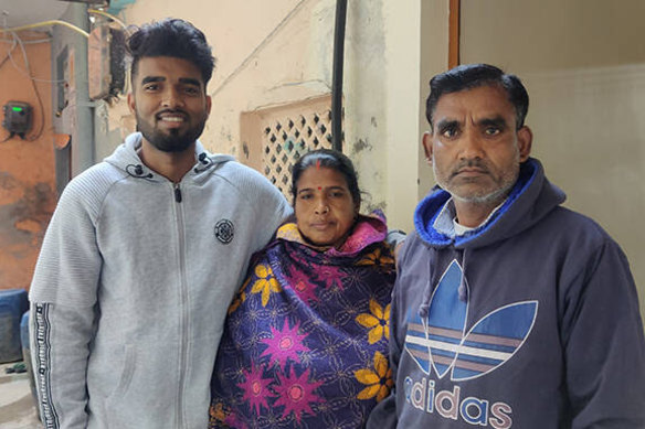 Amritesh Kumar Maurya with his parents at their home in Delhi.