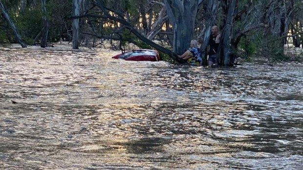 ‘You’ve got to do something’: How Mitch braved floodwaters to save a woman