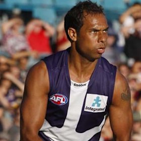 Roger Hayden in flight for the Dockers.