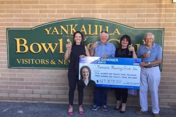 Liberal candidate Georgina Downer presents a cheque to the Yankalilla Bowling Club in February 2019.