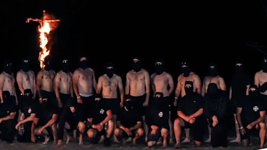National Socialist Network members set fire to a cross during a visit to the Grampians National Park at the weekend.