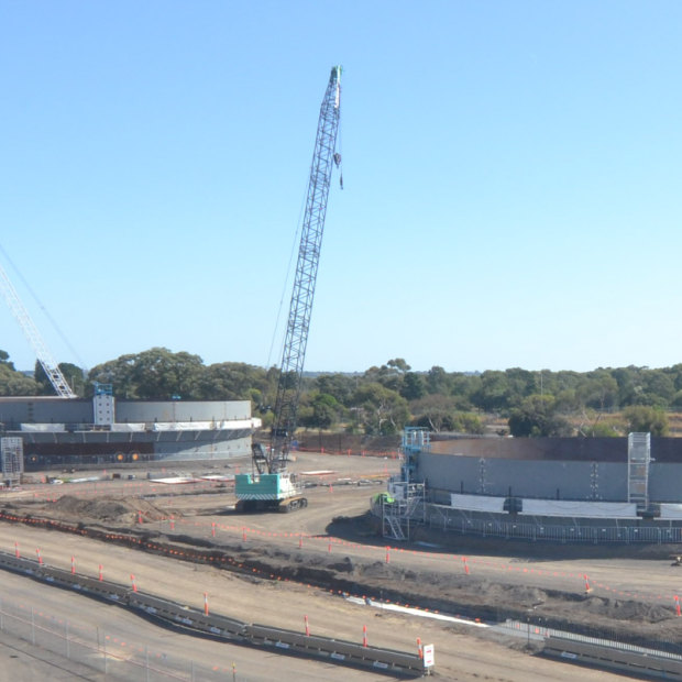 The view from the Corio train station platform of new diesel storage tanks being built at the Geelong oil refinery, one of just two refineries left in Australia.
