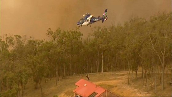 Footage taken from a Channel 9 helicopter shows David Key's crew struggling to rescue four people from Coombs Road, in Kinglake West.