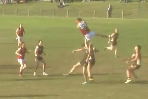 Daniel Wood clutches the ball mid-air.