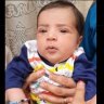 Baby lost after being passed over Kabul airport wall returned to family