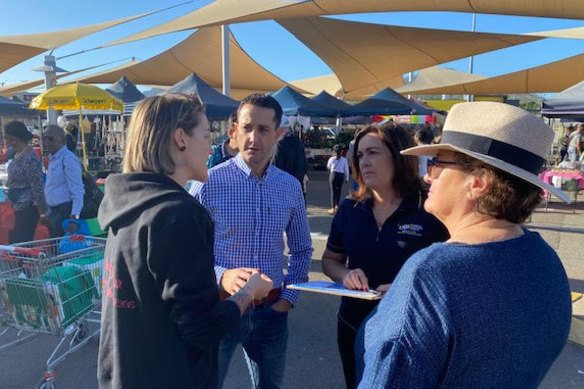 LNP leader David Crisafulli talks to locals at Willows Rotary Markets in Townsville on Sunday.