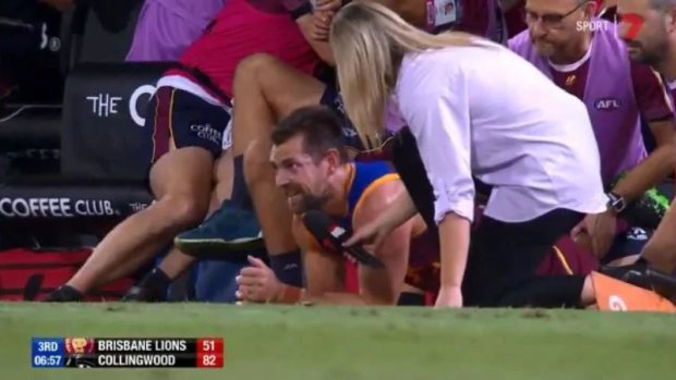 Innovation: Luke Hodge was interviewed mid-rub during a Brisbane Lions match against Collingwood last season. 