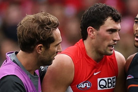 Callum Brown apologises to Tom McCartin after his head-high bump in the derby.