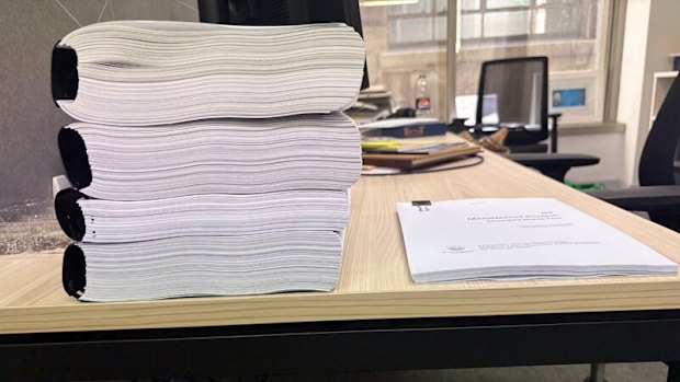 Colleen Harkin says the left pile is Australia’s maths curriculum and the right pile is Singapore’s. 