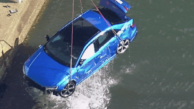 Drivers hit with multiple charges over fatal crash that plunged Audi into water