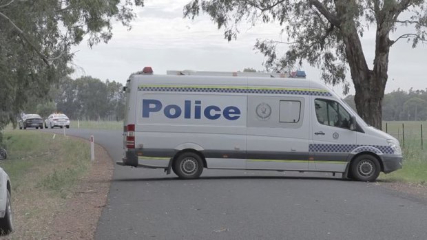 Police block off the road where a teenage boy was found dead by a passing motorist in the early hours of Wednesday morning. 