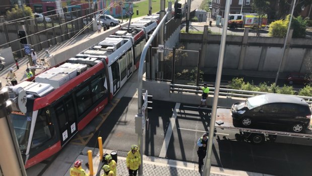 A car has crashed into a tram on South Dowling Street, Surry Hills.