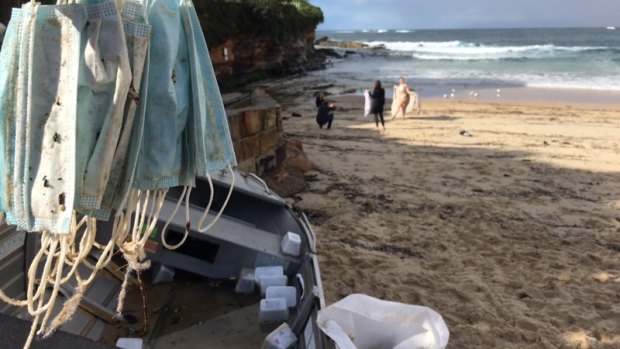 Masks collected on Coogee Beach after containers fell from a ship.