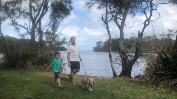 Berrara resident Matt Jansch, with son Joshua at Berrara Lagoon, said locals were scared of the "influx of people" in recent weeks.