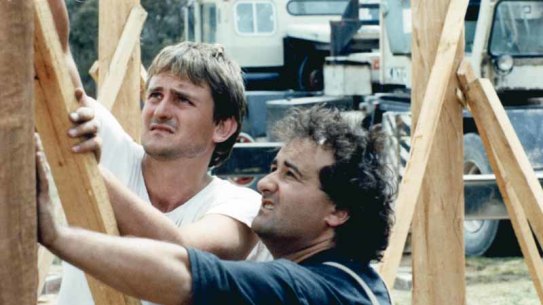 Richard Glover and Philip Clark building the frame of Richard's mud brick house.