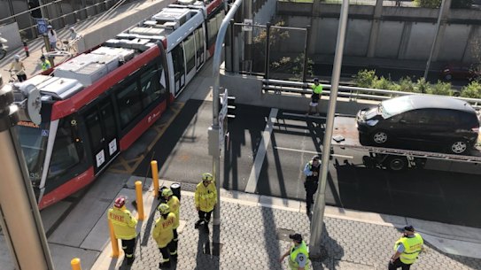 A car has crashed into a tram on South Dowling Street, Surry Hills.