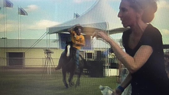Video taken by an anti-Adani protester of a man riding a horse through Clermont showground before a woman was hit on Sunday, April 28, 2019. Credit: Glenn Conroy.