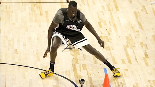 Makur Maker in the NBA Draft combine, and playing for the Sydney Kings in the NBL.