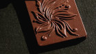 Elements chocolates are stamped with a flower that signifies beauty.