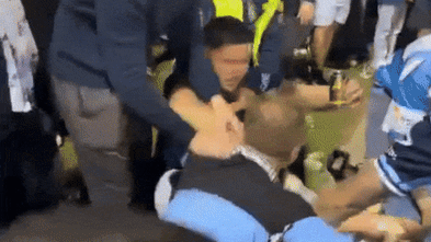 Police investigate wild brawl between Roosters and Sharks supporters