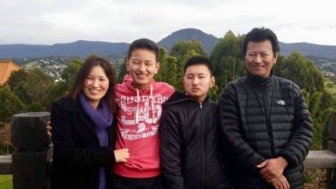 Kinley Wangyel Wangchuck  (in black second from right) with his mother Jangchu, father Tshering and brother Tenzin.