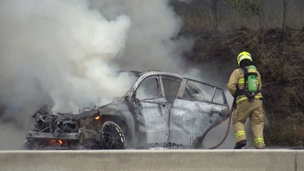 The car caught alight after crashing on the Moorebank Avenue off-ramp.