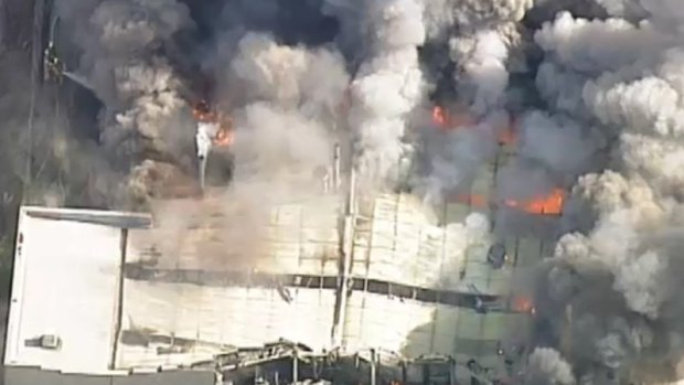 More than dozen firefighters are battling a fire that has tore through a food processing factory in Melbourne's south-east.