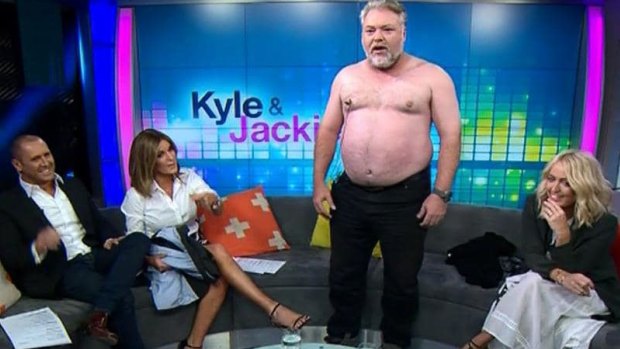 Kyle Sandilands takes his top off on Channel 7's <i>The Morning Show</I> alongside  Larry Emdur (left), Kylie Gillies and Jackie 'O' Henderson in 2015.